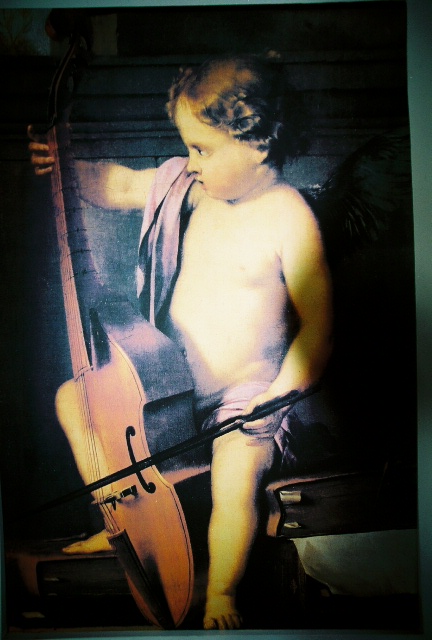 cupid playing the cello at a church in Hawaii